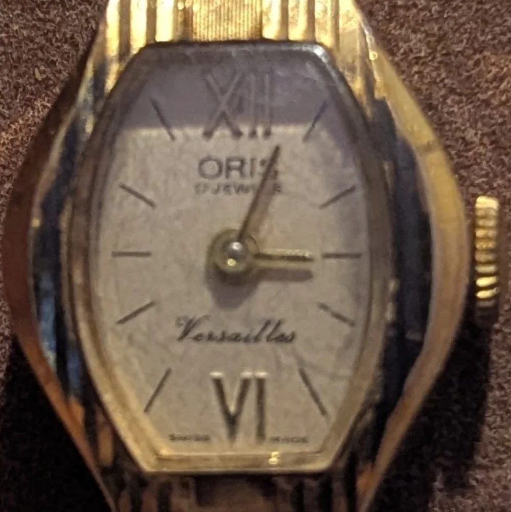 Oris Gold Timepiece with Ivory Dial